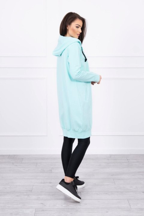 Bluza miętowa do kolan z kieszeniami – pastelowa stylizacja casual