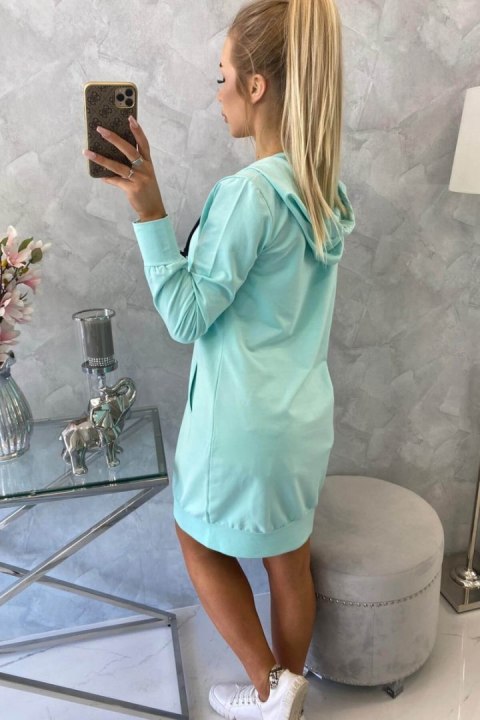 Bluza miętowa do kolan z kieszeniami – pastelowa stylizacja casual