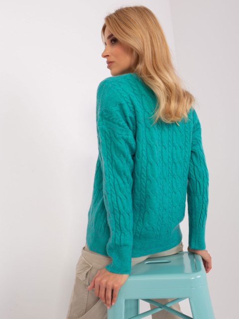 Sweter damski niebieski z warkoczami i ściągaczami oversize Sweter damski niebieski z warkoczami i ściągaczami oversize