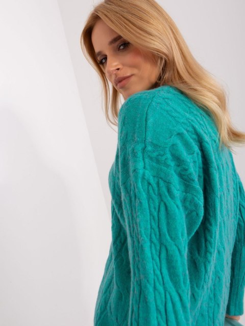 Sweter damski niebieski z warkoczami i ściągaczami oversize Sweter damski niebieski z warkoczami i ściągaczami oversize