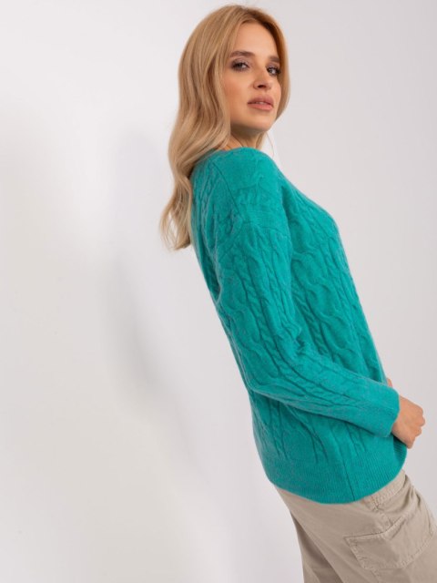 Sweter damski niebieski z warkoczami i ściągaczami oversize Sweter damski niebieski z warkoczami i ściągaczami oversize