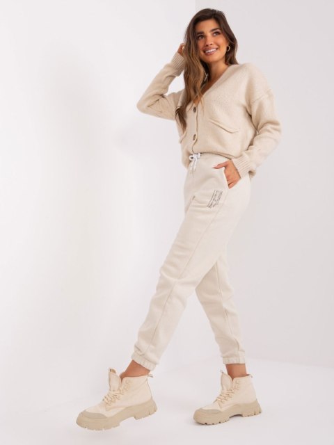 Spodnie dresowe D10047O62214B4 jasny beżowy M