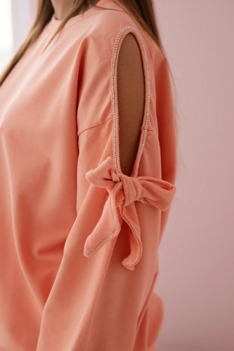 Komplet bluza z kokardą na rękawach i legginsy łososiowy Komplet bluza z kokardą na rękawach i legginsy łososiowy
