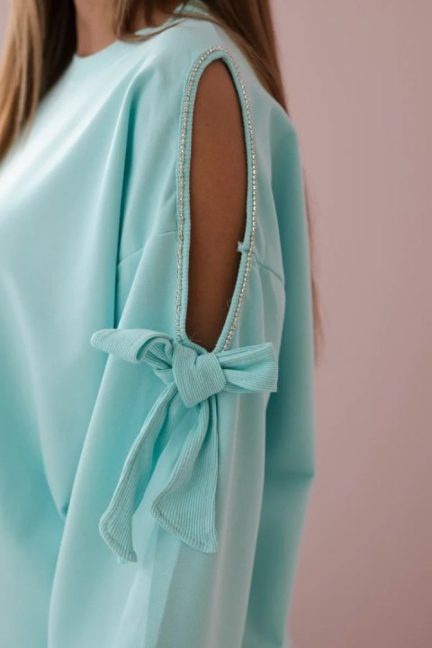 Komplet bluza z kokardą na rękawach i legginsy miętowy Komplet bluza z kokardą na rękawach i legginsy miętowy