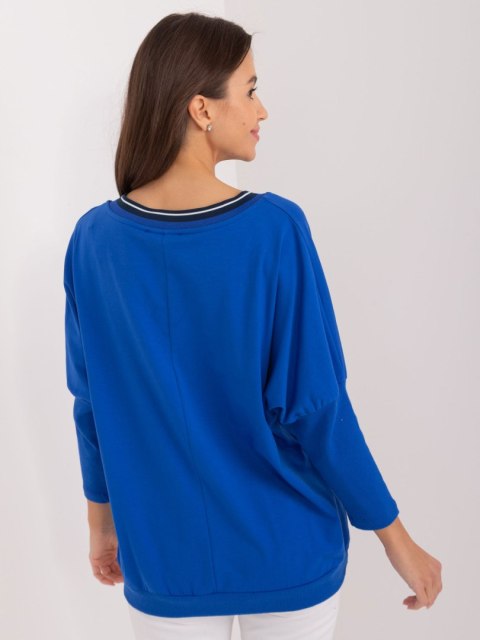 Bluzka oversize kobeltowa, rekaw 3/4, dekolt w serek, z napisem Bluzka oversize kobeltowa, rekaw 3/4, dekolt w serek, z napisem