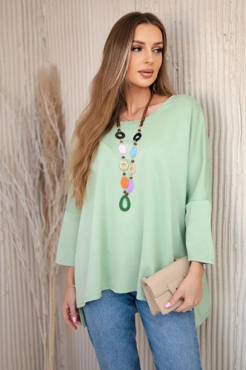Bluzka oversize z wisiorkiem Masełko pistacjowa Bluzka oversize z wisiorkiem Masełko pistacjowa