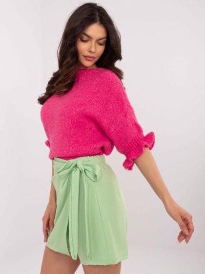 Sweter oversize różowy z krótkim rękawem i falbanką