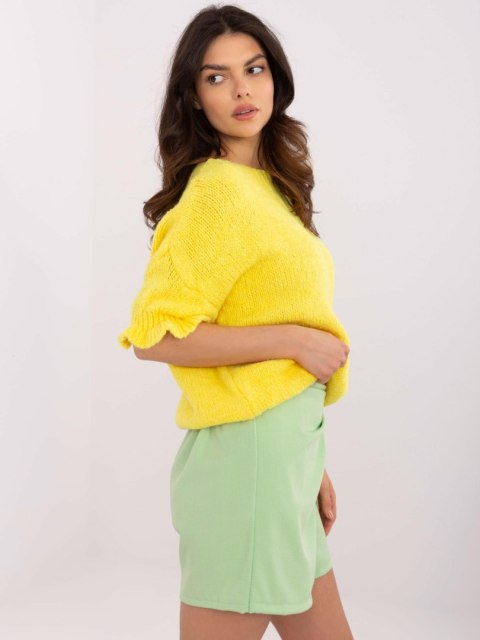 Sweter oversize żółty z krótkim rękawem i falbanką