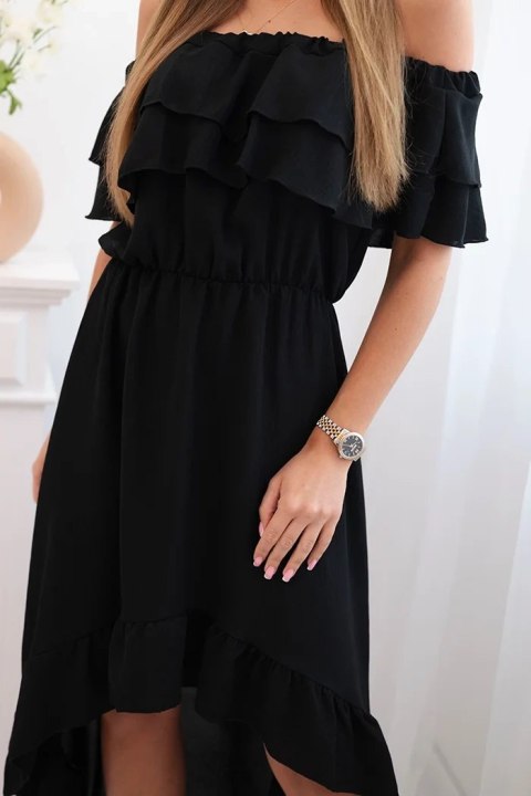 Modelka w czarnej sukience hiszpance z falbanami i dłuższym tyłem – klasyczny, elegancki look na lato Modelka w czarnej sukience hiszpance z falbanami i dłuższym tyłem – klasyczny, elegancki look na lato