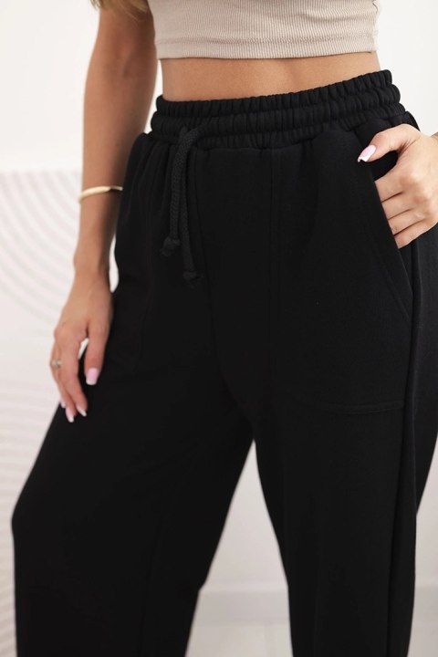 Szerokie spodnie z troczkiem w pasie – Stylowy Wieszak