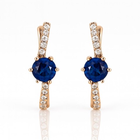 Stylowe kolczyki damskie w odcieniu jasnego złota z niebieską cyrkonią