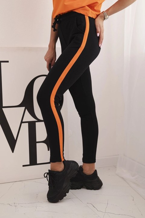 Modny komplet damski z lampasem w pomarańczowym kolorze