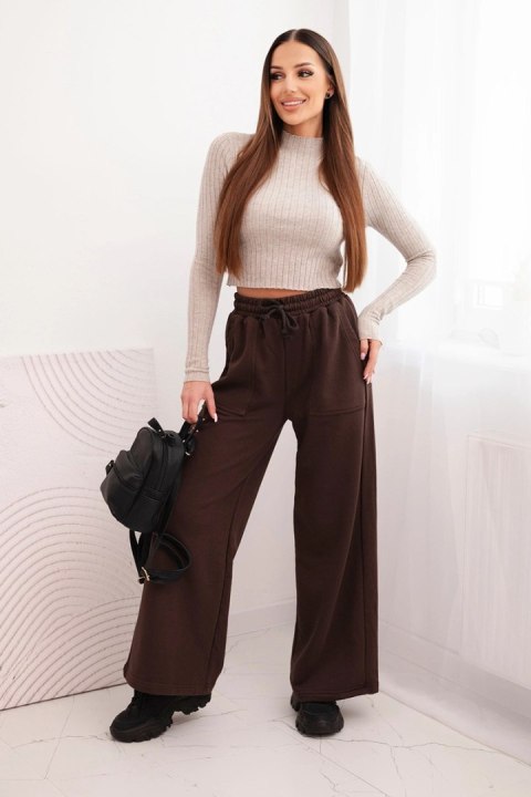 Damskie spodnie z elastycznym pasem i kieszeniami brązowe