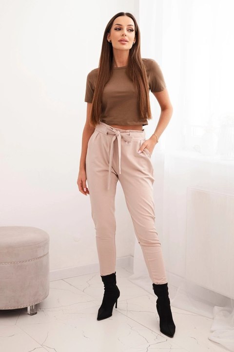 Bawełniane spodnie damskie beżowe z eleganckim wiązaniem