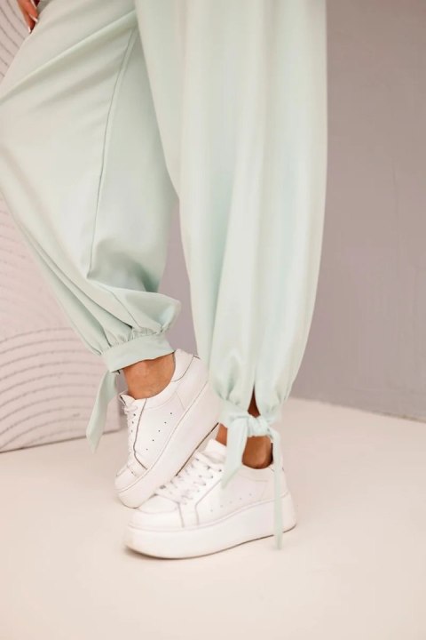 Włoskie spodnie damskie z szeroką nogawką w kolorze ciemno miętowym