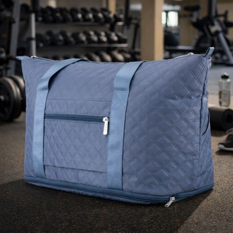 Treningowa torba wykonana z poliestru w niebieskim kolorze, wyposażona w uchwyt na walizkę - Peterson
