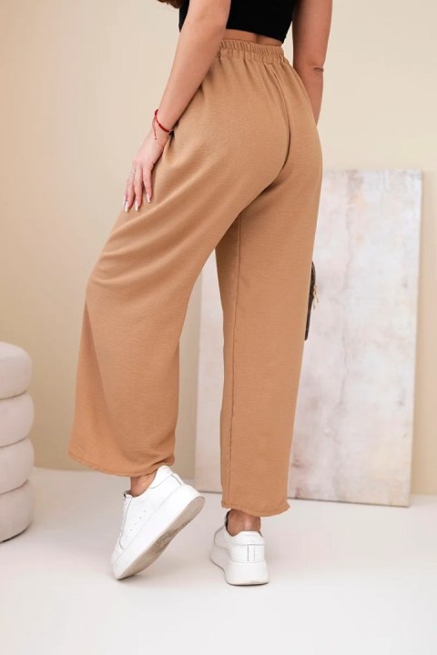 Luźne spodnie damskie camel z gumką w pasie