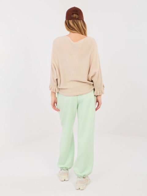 Casualowe pastelowe zielone spodnie dresowe damskie – stylizacja