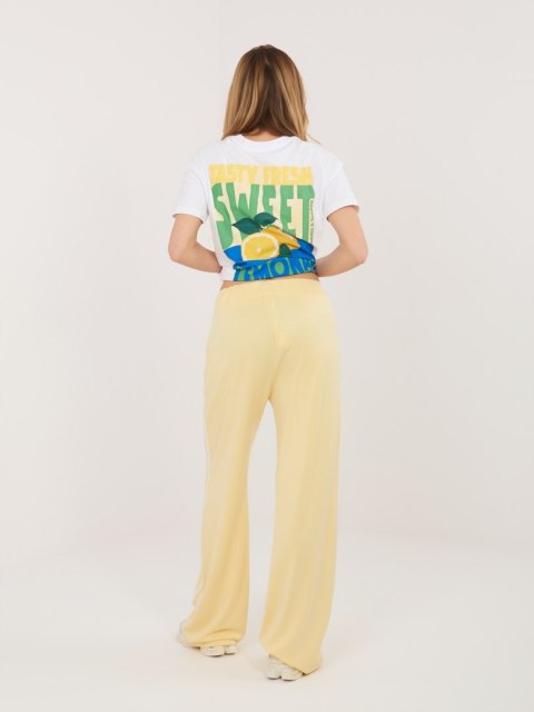 sportowe spodnie damskie jasnożółte z lampasami