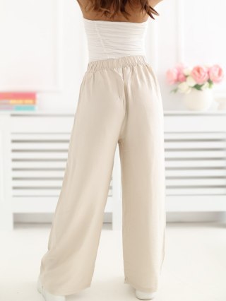 Jasnobeżowe spodnie damskie wide leg z wysokim stanem i wiązaniem